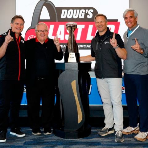 (From left) Hendrick Motorsports Vice Chairman Jeff Gordon, Performance Racing Network President Doug Rice, Speedway Motorsports President and CEO Marcus Smith and Charlotte Motor Speedway President and General Manager Greg Walter pose next to a Bruton Smith Trophy presented to Rice on Saturday. The broadcasting legend wraps up his 36-year career this month.