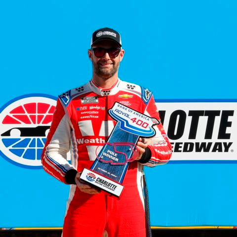 Shane Van Gisbergen holds his pole winner trophy after claiming the pole for Sunday's Bank of America ROVAL™ 400. 